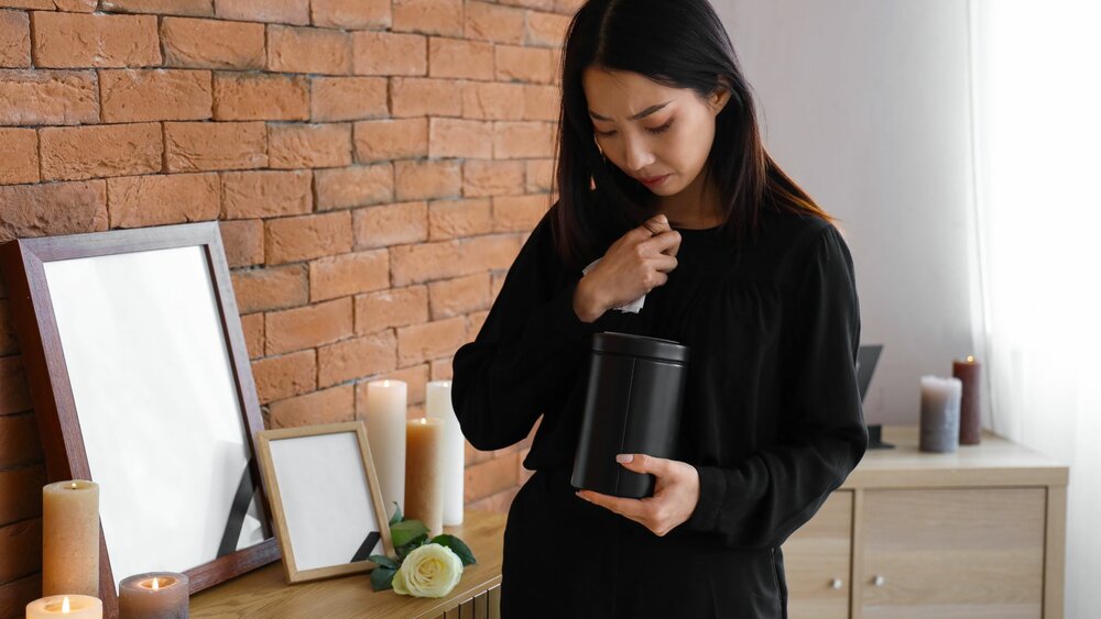 Woman holding an urn