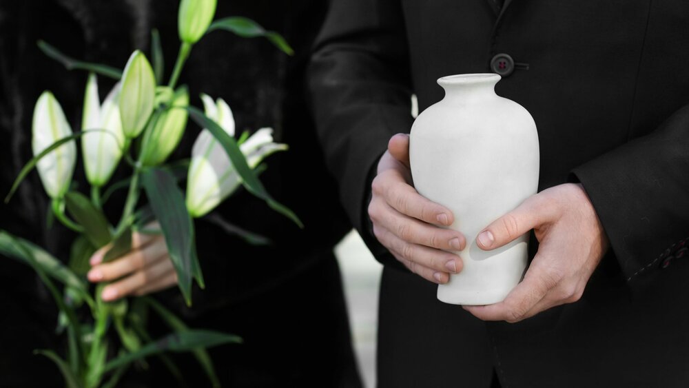 Man holding an urn